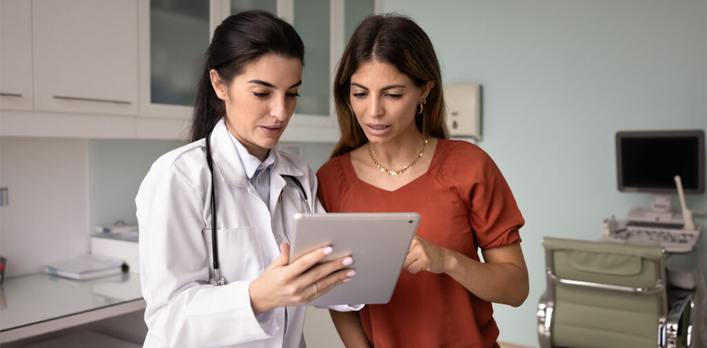 Woman discussing hormone replacement therapy for women during medical consultation