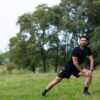 Man stretching outdoors after discovering how long does TRT take to work through consistent testosterone replacement therapy