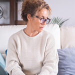 Woman experiencing emotional changes and menopause symptoms related to HRT for mood swings in women