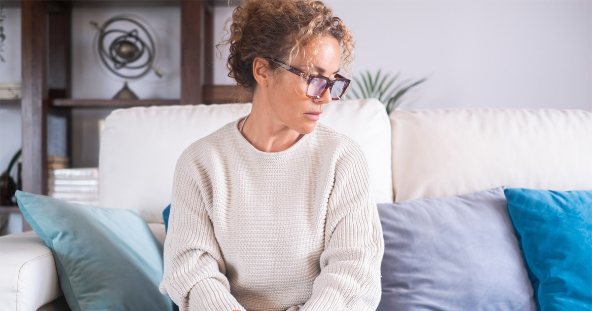 Woman experiencing emotional changes and menopause symptoms related to HRT for mood swings in women