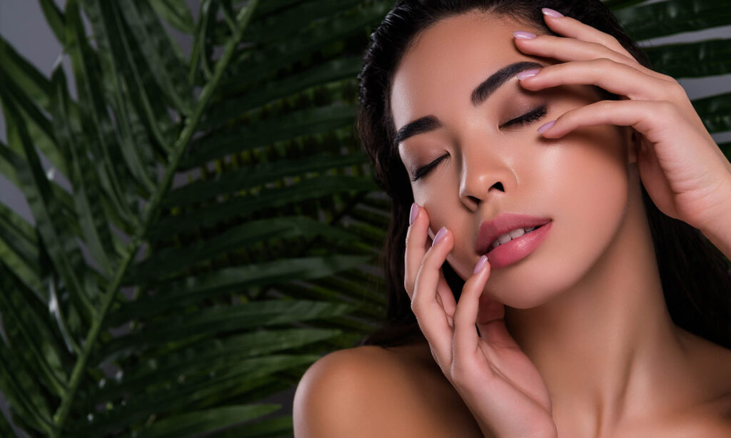 Woman with closed eyes, serene expression.